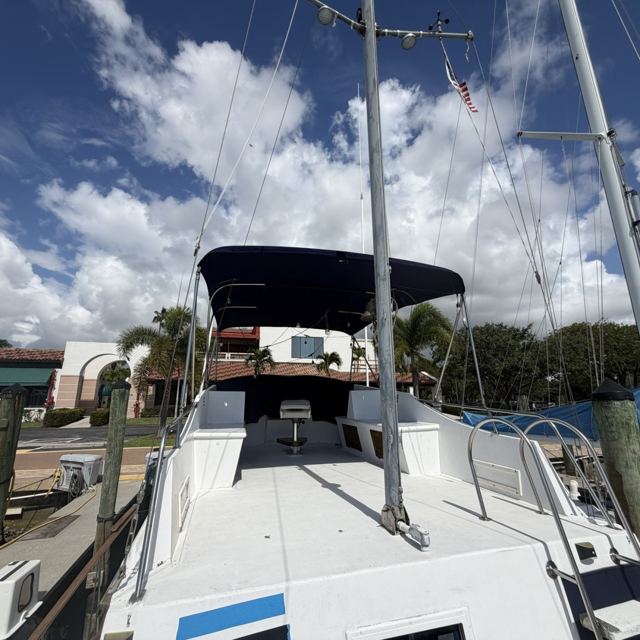 Mast and flybridge Bimini against the sky