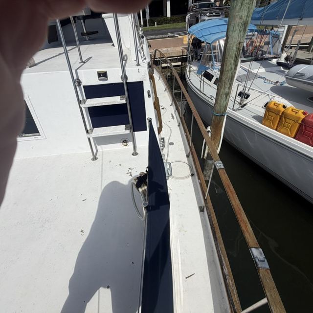 Side deck and flybridge ladder at the dock