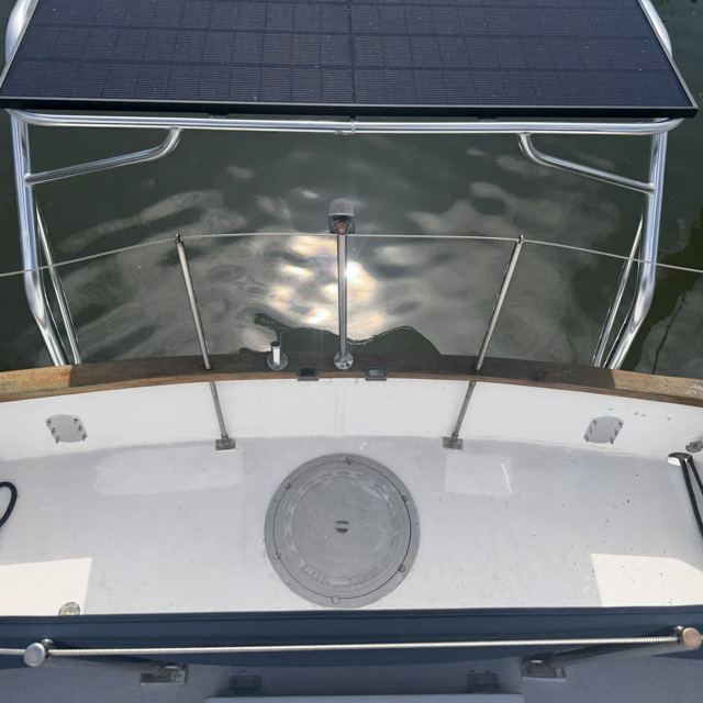 Stern frame overhead, looking aft over the water